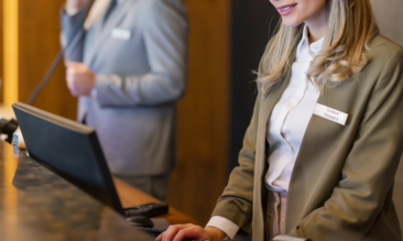 Happy hotel staff having learned how to improve hotel operations