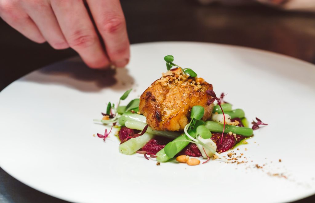Chef preparing a dish at a Michelin Star Restaurant in 2025