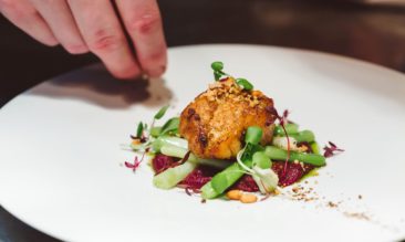 Chef preparing a dish at a Michelin Star Restaurant in 2025